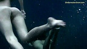 Girls swim underwater on Tenerife