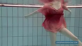 katya okuneva relaxes in red dress by the pool