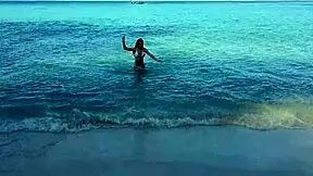 naked redhead girl enjoys a sunny bath at public beach