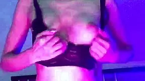 A young blonde pleasures herself with a rubber dildo.