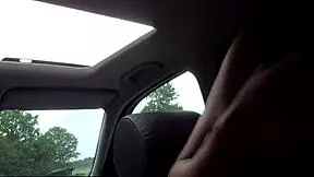 a skinny redhead bitch swallows deep in the parking lot