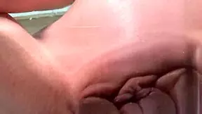 Why is the petite teen rubbing on the glass table?