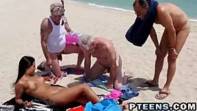 Lovely teen banged with fat dicks on beach