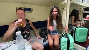 Friends meet a stranger in the train compartment