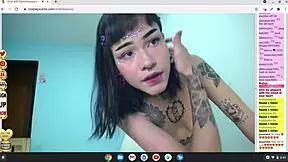 Petite rocker cosplay tattooed babe naked on cam for anime hentai fun.