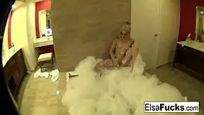 Cute Elsa pleasures herself in a bubble bath