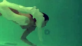Russian cutie in pool striptease