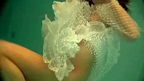 Russian babe natalia swims naked and strips in the pool