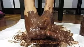 My Feet With Varnished Nails Covered In Chocolate Cream