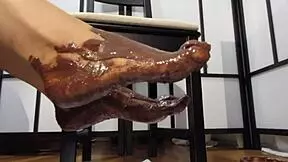 My Feet With Varnished Nails Covered In Chocolate Cream