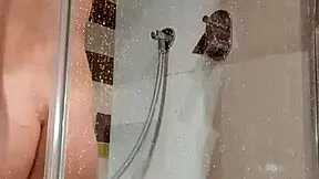bitch fucks herself in the shower with a dildo