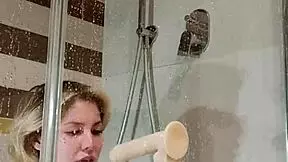 bitch fucks herself in the shower with a dildo
