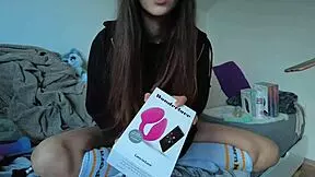 Teen pornstar unboxes her collection of toys with excitement.
