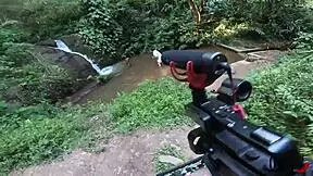 Black teen takes photos and videos in the stream