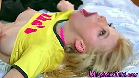 petite lesbian enjoys oral pleasure and rubs her body suggestively.