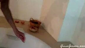 Blonde teen gives footjob in home video