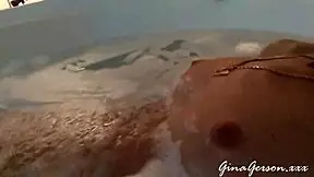 Blonde teen gives footjob in home video