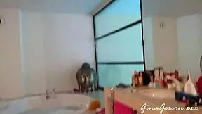 Blonde teen gives footjob in home video