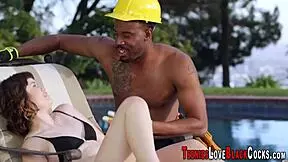 A young babe jerks off a big black dick