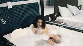 Petite hairy amateur teen masturbates with a dildo in the motel shower, reaching orgasm.