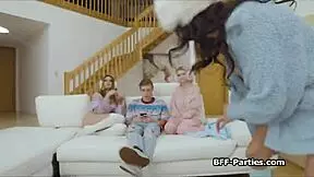 Three girlfriends enjoy a party with friends