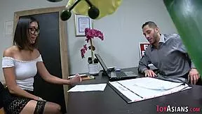 Tiny Asian intern works hard in the office.