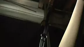 Tina, dressed in sexy red lingerie, gets exploited in a dark BDSM fantasy. She’s tied up and bent over for control.