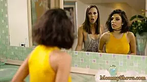 Lesbian stepmom devours stepdaughter’s pussy in steamy 3some