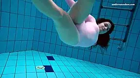 Petite brunette teen Liza Bubarek bathes as underwater mermaid