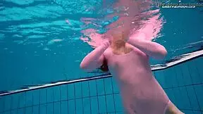 Petite brunette teen Liza Bubarek bathes as underwater mermaid