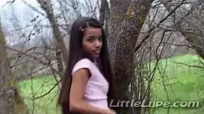 Little lupe masturbates tight pussy at woods