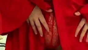 brunette girl in red lingerie masturbates in a reality setting