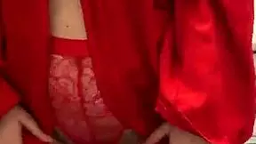 brunette girl in red lingerie masturbates in a reality setting