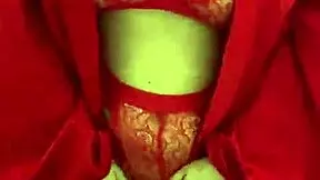 brunette girl in red lingerie masturbates in a reality setting