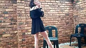 smoking a cigarette and shaking ass while pissing