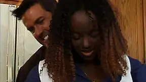 In this scene, the ebony cheerleader gets involved in a hardcore kitchen encounter.