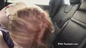 Watch this redhead teen sucking hard cock in the backseat