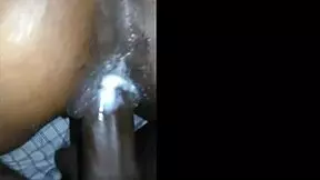 close-up view of a young bride receiving creamy backshots during her wedding night in doggystyle.