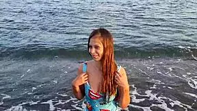 Check out the horny teen with a big ass on the beach getting public action.