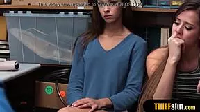 Pervy cop catches two shoplifter chicks fucking together.