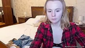 Blonde teen winks in underthings