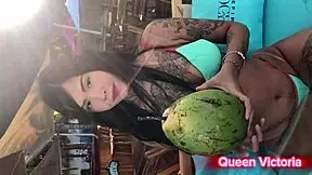 Queen rides dildo on beach 🌊