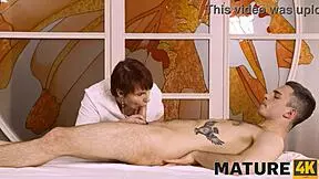 mature woman and client share fun in massage parlor setting