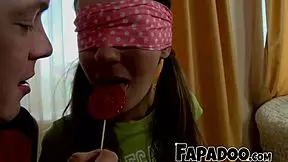 Watch this teen lick lollipop sensually before sucking cock?