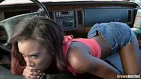 Black babe eagerly slurps a white cock in a steamy interracial scene.