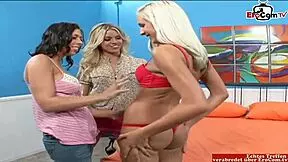 these three girls, one brunette and two blondes, are having a lesbian threesome with dildos