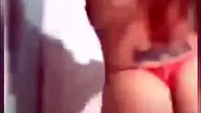 Is my Peruvian cousin twerking on webcam in red lingerie for a live show?