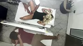 Real footage shows a masseur banging a woman right next to her clueless husband.