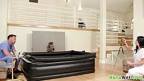 Naughty brunette masseuse films wet nuru massage with big tits