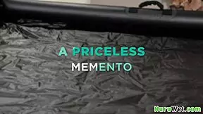 Naughty brunette masseuse films wet nuru massage with big tits